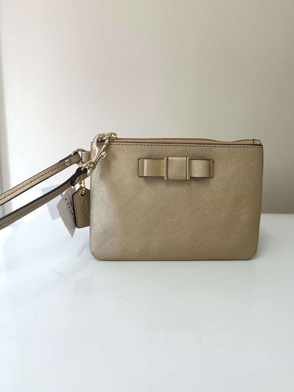 NWT Coach Gold Saffiano Leather Wristlet with Bow Accent
